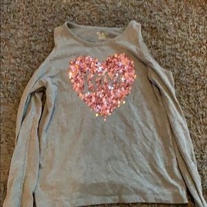 A long sleeve off the shoulder shirt